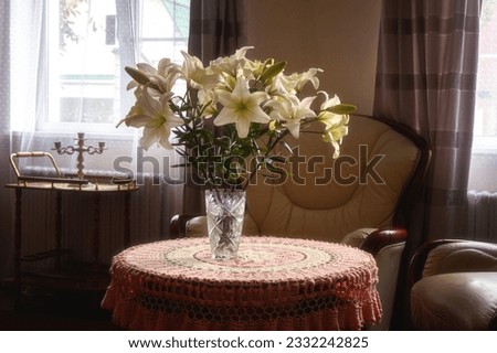 Still life with a bouquet of lily flowers in the interior