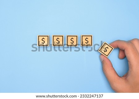 financial icon on wooden block. financial symbol on wooden with clean background. High quality photo