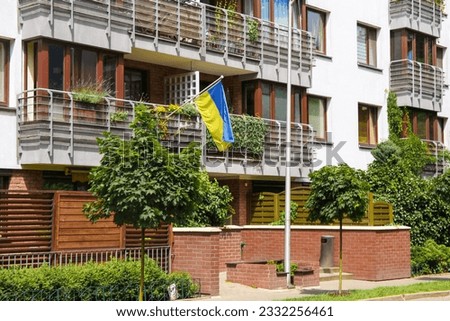 Ukrainian flag hanging on the house