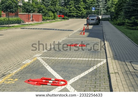 Parking barrier or fence with lock