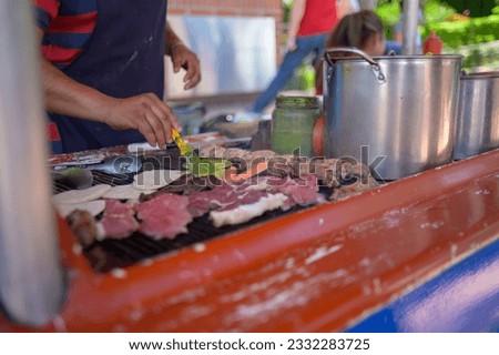 Street food stall in a city celebration.
pots tacos, meat, chorizo, and tortillas. Royalty-Free Stock Photo #2332283725
