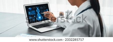 Doctor studying genetic disease in DNA research with laptop, analyze genetic data, formulate medical treatment strategies, and develop healthcare plan for patient with innovative solution. Neoteric Royalty-Free Stock Photo #2332285717