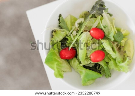 Salad lettuce on white desk