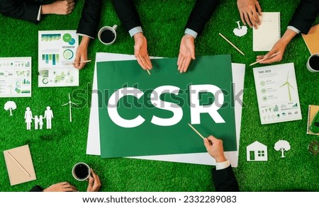 Top view panoramic CSR symbol on green grass table with business people planning for alternative energy utilization for greener sustainable Earth as corporate social responsibility. Quaint Royalty-Free Stock Photo #2332289083