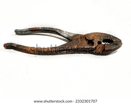decades old worn and rusty pliers still working Royalty-Free Stock Photo #2332301707