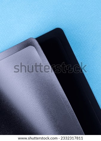 Close-up view of black  plastic document folder on office table