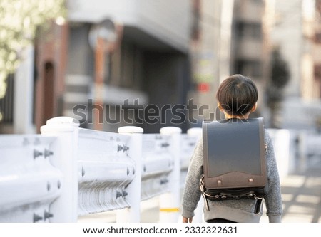 Japanese elementary school students going to and from school alone in urban areas Royalty-Free Stock Photo #2332322631