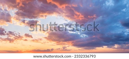 Real majestic sunrise sundown sky background with gentle colorful clouds without birds. Panoramic, big size Royalty-Free Stock Photo #2332336793