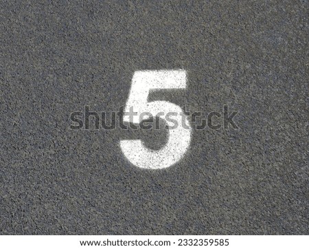 Number 5 of a running track surface pictured from the top. 