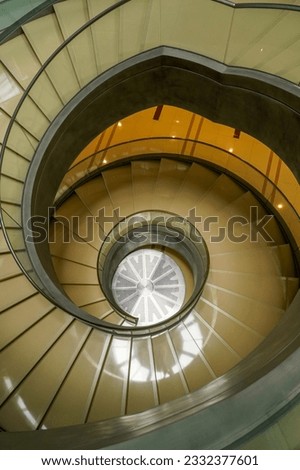 Indoor modern spiral staircase from top view.