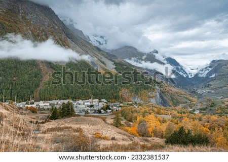 Autumn landscape in the mountains on hike from the hamlet of Les Cours to Lac du Pontet and back, near Villar d'Arene and Col du Lautaret, Hautes-Alpes, France	