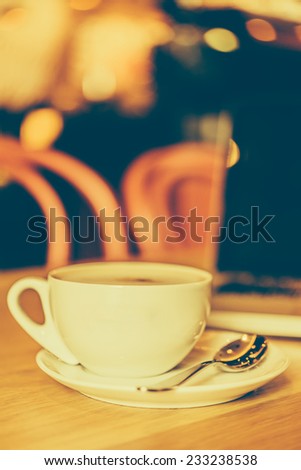 Coffee cup laptop in coffee shop - vintage effect style pictures