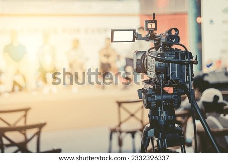 camcorder in press conference seminar on stage record event. video camera live media  broadcast realtime streaming vintage color tone