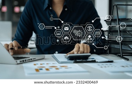 Artificial Intelligence technology. Businessman using a smartphone and laptop computer chatting with an intelligent artificial intelligence. Futuristic technology, automate Chat Bot, Smart Ai.
