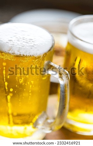 Refreshing Pour: Close-Up of Pouring and Serving Cold Beer into a Glass, Showcased in Crisp 4K Resolution
