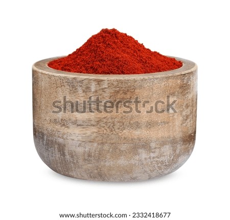 Bowl with aromatic paprika powder isolated on white Royalty-Free Stock Photo #2332418677
