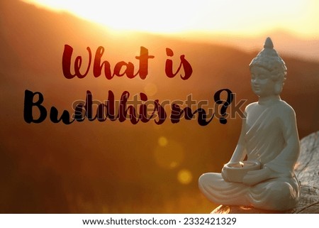 Decorative Buddha statue with burning candle in mountains at sunset and text What Is Buddhism