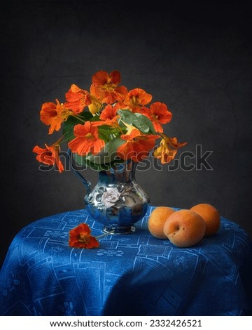 Still life with bouquet of nasturtium and apricots