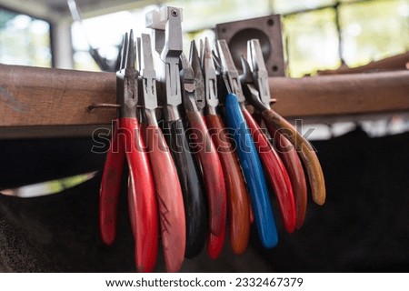 Instruments kit in a large workshop for the manufacture of handmade jewelry Royalty-Free Stock Photo #2332467379