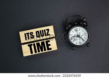 bell and stick clock with the words Its Quiz Time. the concept of answering quizzes or quiz games Royalty-Free Stock Photo #2332476559