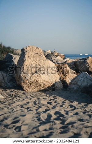 big stones on the sand on the seashore