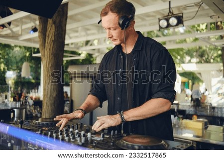 DJ at work on the summer playground.