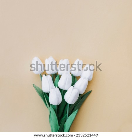 White tulips bouquet pastel yellow background