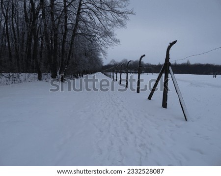 The photo shows a fence in the Buchenwald concentration camp.