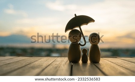 umbrella icon and family model, Security protection and health insurance. The concept of family home, protection, health care day, car insurance.	 Royalty-Free Stock Photo #2332536583