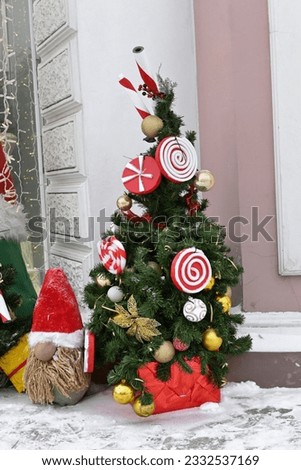 A Christmas tree on the street decorated with Christmas toys. Decoration for New Year and Christmas