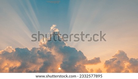 Beautiful colorful sunset sky above clouds with dramatic light, beams. Beautiful sky with sunrise clouds. Dream heaven sun rays amazing nature scene. Peaceful bright skyscape panoramic natural banner Royalty-Free Stock Photo #2332577895