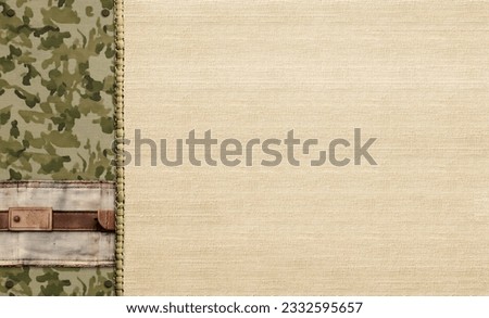 Horizontal retro background with camouflage textile. Vintage backdrop in camo style with old label. Mock up template. Copy space for text

