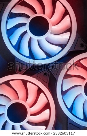 close-up of cooling fans, cooling computers and other electronic equipments with a black background, taken straight from above