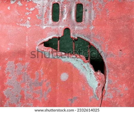 The melted plastic chair looks like a sad face. The broken plastic chair seem like a sad face. Royalty-Free Stock Photo #2332614025