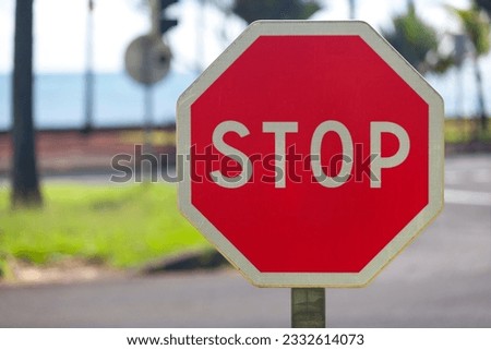Close-up on a European stop sign.