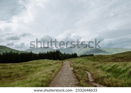 The West Highland Way trail in the mountains and moors in the Highlands of Scotland, United Kingdom.  Royalty-Free Stock Photo #2332648633