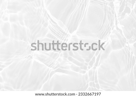White water with ripples on the surface. Defocus blurred transparent white colored clear calm water surface texture with splashes and bubbles. Water waves with shining pattern texture background. Royalty-Free Stock Photo #2332667197