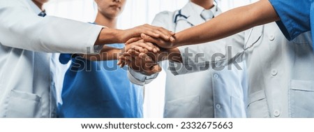 Group of medical staff doctor nurse and healthcare specialist profession coordinating synergy hand in hospital. Medical teamwork and healthcare cooperation in panoramic banner background. Neoteric Royalty-Free Stock Photo #2332675663