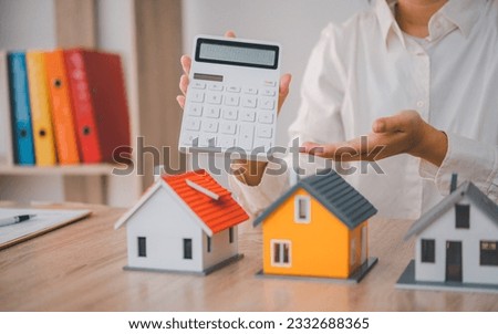 Salesperson Holding house keys concept, house keys for new house, new house purchase.