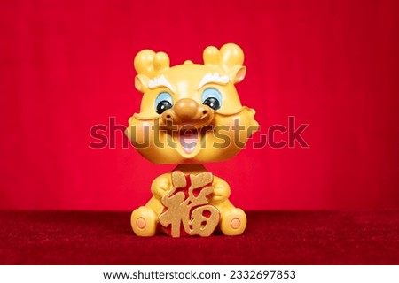 Chinese New Year of Dragon mascot on red at horizontal composition translation of the Chinese word is fortune no logo no trademark