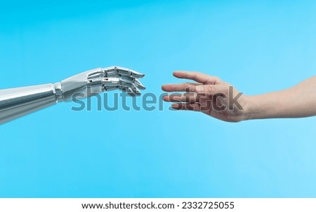 Human hand touching robot hand. Royalty-Free Stock Photo #2332725055
