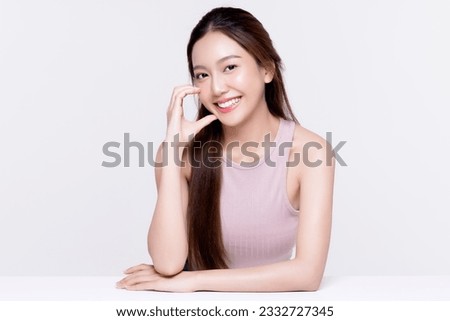 Beautiful young Asian woman with healthy and perfect skin on isolated white background. Facial and skin care concept for commercial advertising. Royalty-Free Stock Photo #2332727345