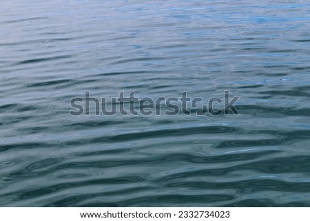 Photo illustration of a view of a choppy sea and beach and blue sky in a tropical country