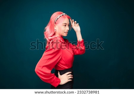 Beautiful Asian women with red pink hair color.