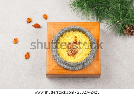 Rice cooked in a stone pot with healthy ginkgo, jujube, ginseng, and miscellaneous grains. Royalty-Free Stock Photo #2332742423