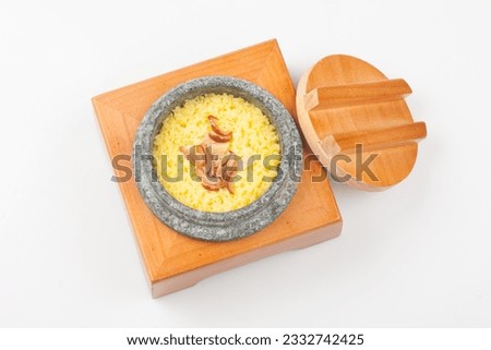 Rice cooked in a stone pot with healthy ginkgo, jujube, ginseng, and miscellaneous grains. Royalty-Free Stock Photo #2332742425