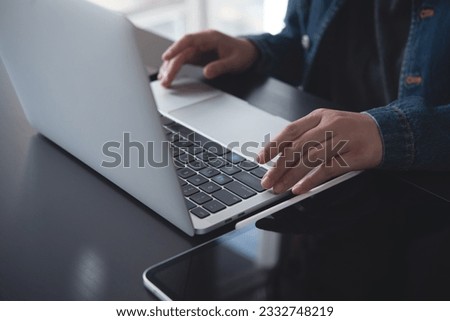 Close up of business woman hands typing on laptop keyboard on table, online working from home office, searching the information on internet network, e-learning, telecommuting concept