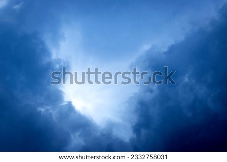 Sunbeam through the cloud on blue sky