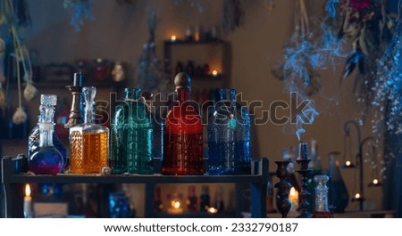 magic potions in  witch's house with burning candles at night Royalty-Free Stock Photo #2332790187