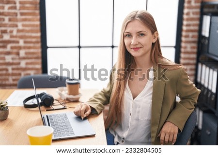Young caucasian woman business worker using laptop working at office